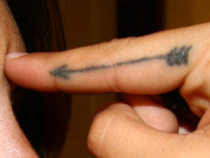 Sierra Kusterbeck arrow tattoo