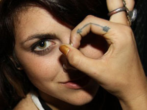 Sierra Kusterbeck arrow tattoo
