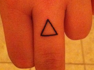 Sierra Kusterbeck triangle tattoo
