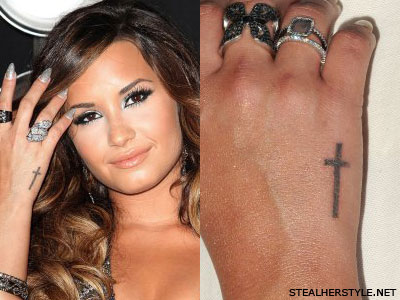Demi Lovato's cross tattoo on her hand