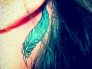 Demi Lovato feather tattoo