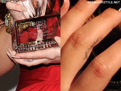 Demi Lovato's peace tattoo on her finger