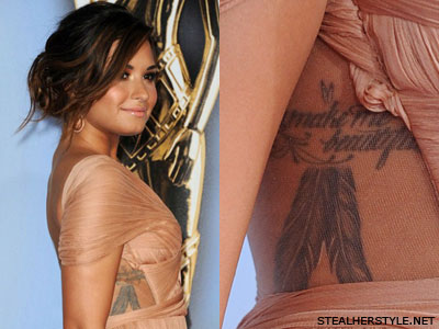 Demi Lovato's side piece with You Make Me Beautiful and feathers