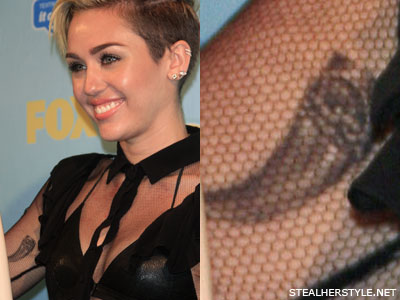 Miley Cyrus' tooth tattoo