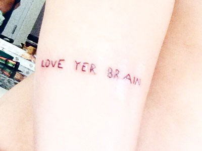 Miley Cyrus love yer brain tattoo