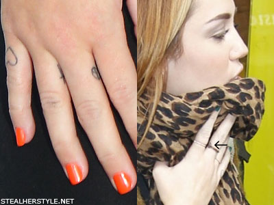 Miley Cyrus peace sign tattoo a peace sign on the side of her middle finger