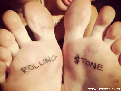 Miley Cyrus' "Rolling $tone" tattoos on her feet