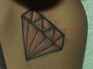 Dev's pink diamond tattoo