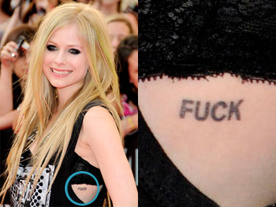 Avril Lavigne's Fuck tattoo on her ribcage