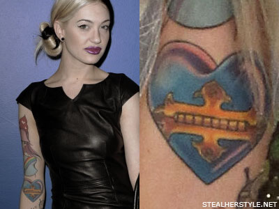 One of Porcelain's earliest tattoos is the colorful blue heart with a golden