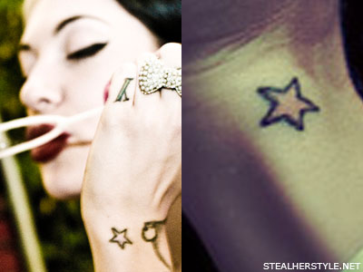 On Porcelain's left wrist is a pink star with a black outline