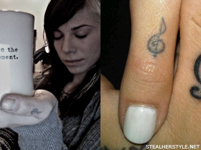 Christina Perri treble clef thumb tattoo