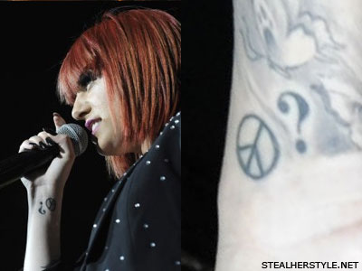 Cher Lloyd peace sign wrist tattoo