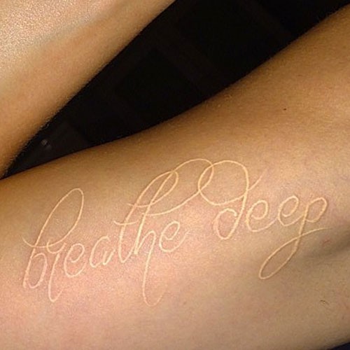cara-delevingne-breathe-deep-tattoo