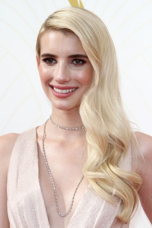 Emma Roberts Wavy Platinum Blonde Faux Sidecut Side Part Hairstyle