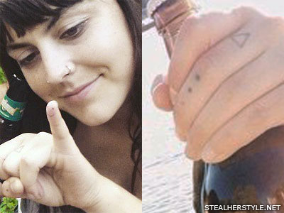 Sierra Kusterbeck smiley face finger tattoo