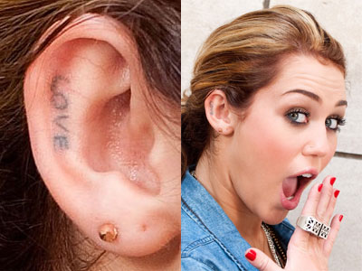 Miley Cyrus LOVE ear tattoo