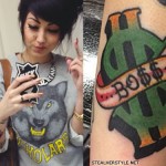 Melissa Marie Green dollar sign arm tattoo