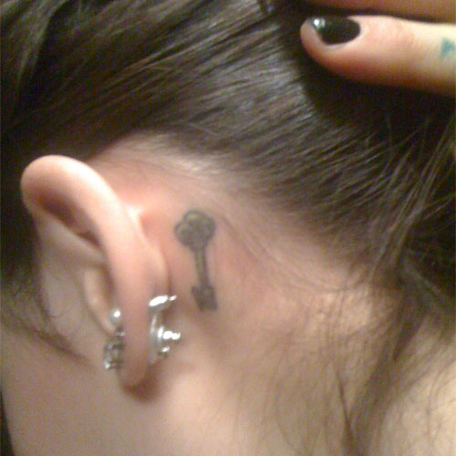 Mindy White's skeleton key tattoo behind her ear