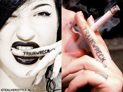 Porcelain Black Trainwreck finger tattoo