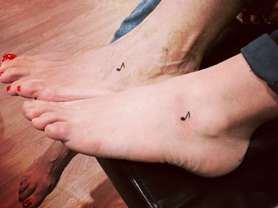Christina Perri music note foot tattoo