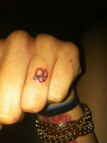 Krysta Cameron finger heart tattoo