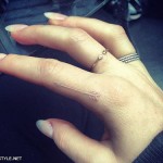 Ellie Goulding white ink arrow tattoo