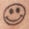 Lily Allen smiley face wrist tattoo