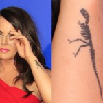 Jojo Levesque dinosaur arm tattoo