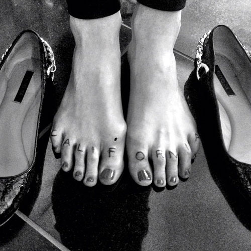 Various black tattoos on feet - Tattoogrid.net