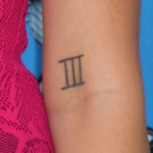 Janel Parrish Roman Numeral Elbow Tattoo | Steal Her Style