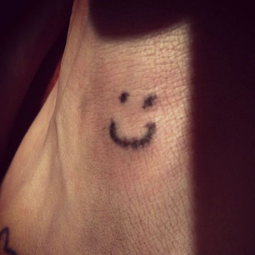 kesha-tattoo-foot-smiley