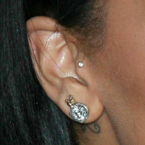 Rihanna has two earlobe piercings and a tragus piercing on her right ear.