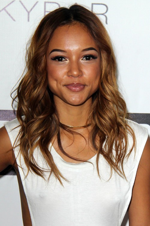 Karrueche Tran Wavy Medium Brown All-Over Highlights Hairstyle | Steal Her Style