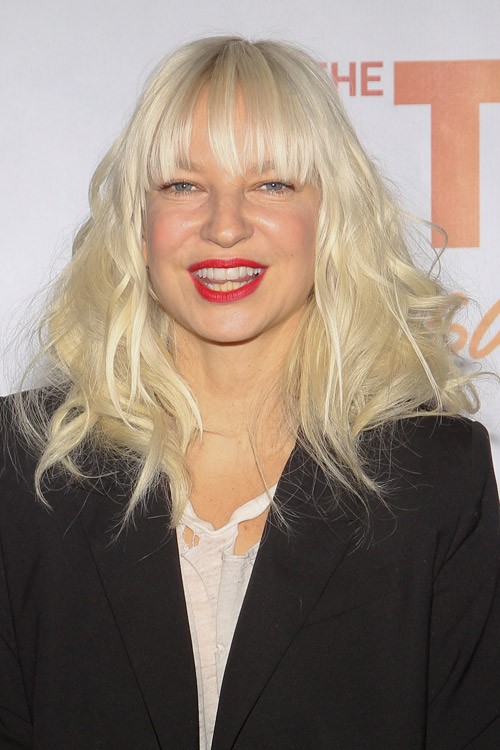 Sia Furler Wavy Platinum Blonde Thin Bangs Hairstyle 