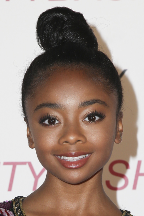 Skai Jackson Curly, Teased Dark Brown Bun Hairstyle 