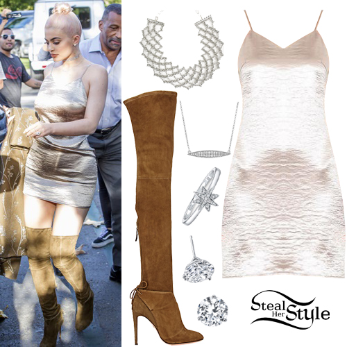 Who made Kylie Jenner's black ankle boots, gold jewelry, satin spaghetti  dress, white tee, and brown pr…
