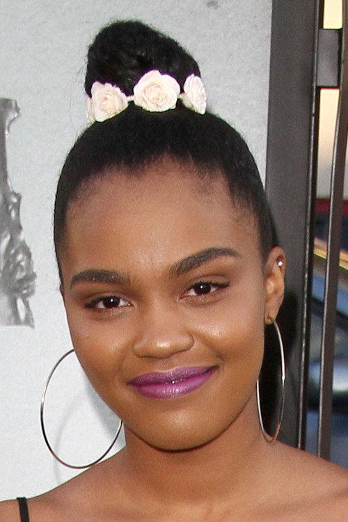 China Anne McClain Teased Dark Brown Bun Hairstyle | Steal Her Style