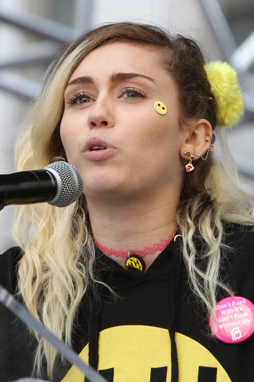Miley Cyrus Wavy Medium Brown Platinum Blonde Dark Roots Side Part Hairstyle Steal Her Style