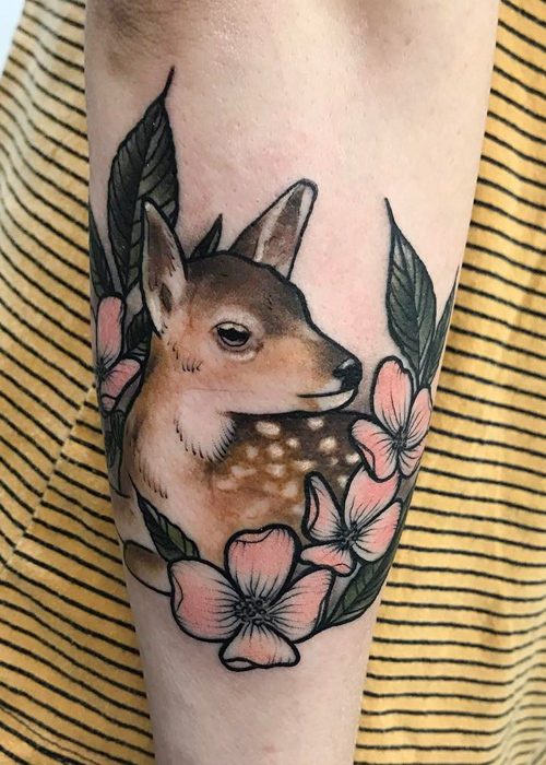 Floral deer head tatto located on the forearm