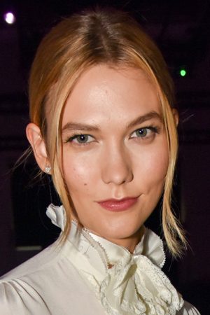 Karlie Kloss Straight Light Brown Bun, Dark Roots, Face-Framing Pieces ...