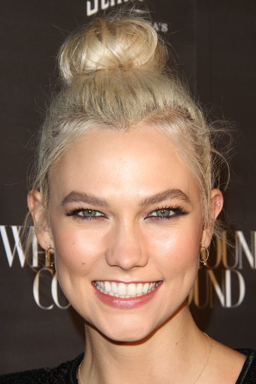 Karlie Kloss Straight Platinum Blonde Bun, Dark Roots Hairstyle | Steal ...