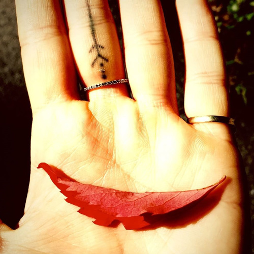 Tiny arrow tattoo on the ring finger - Tattoogrid.net