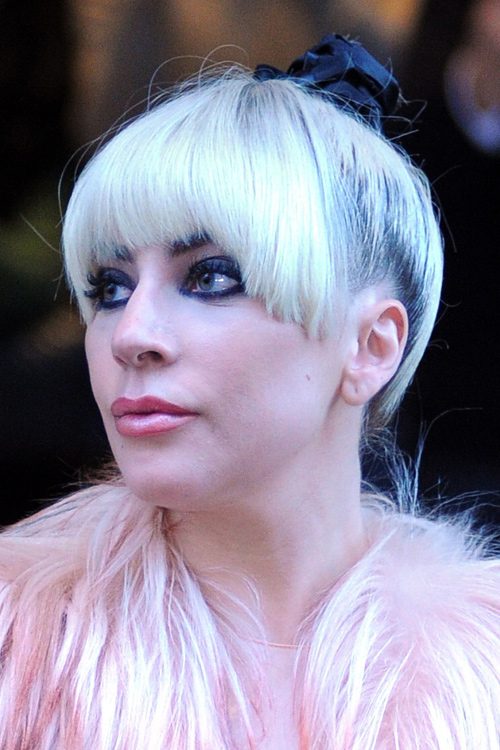 Lady Gaga Straight Silver Bun, Curved Bangs, Dark Roots 