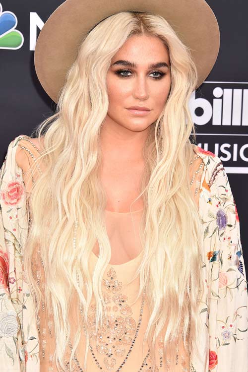 Kesha Wavy Platinum Blonde Angled, Dark Roots Hairstyle 