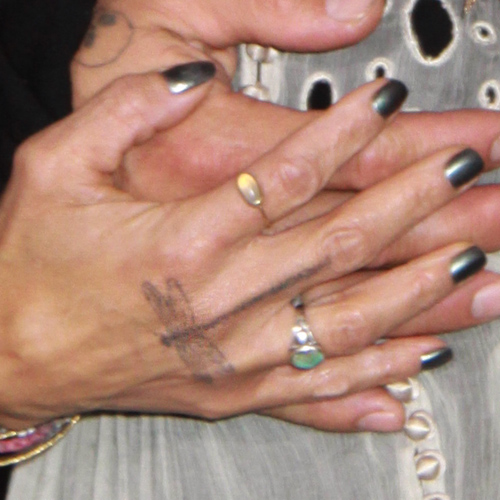 Lisa Bonet Dragonfly Back of Hand Tattoo | Steal Her Style