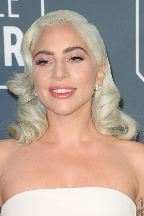 Lady Gaga Wavy Platinum Blonde Barrel Curls Hairstyle | Steal Her Style